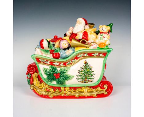 This fantastic cookie jar depicts Santa in his overloaded sleigh with toys and gifts for all. This item has its original box 