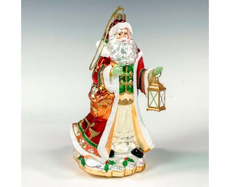 A Crimson Holiday tree ornament featuring Santa Claus carrying a lantern. Fitz and Floyd factory backstamp. This item has its
