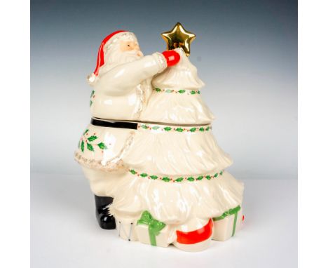 From the Spode Holiday Collection, this elegant porcelain figural cookie jar depicts Santa in all white, gracefully painted a