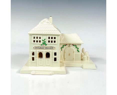 A fine porcelain decorated with shimmering glitter and hand applied gilded borders. Christmas Village collection. Building li