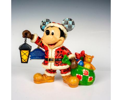 Part of the Walt Disney Collection. A decorative carved-like figure of Mickey Mouse as Santa, holding a sack of toys and a la
