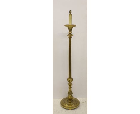 A gilded carved wood standard lamp base, foliate vase and reeded stem, stiff leaf decorated circular foot, fitted for electri