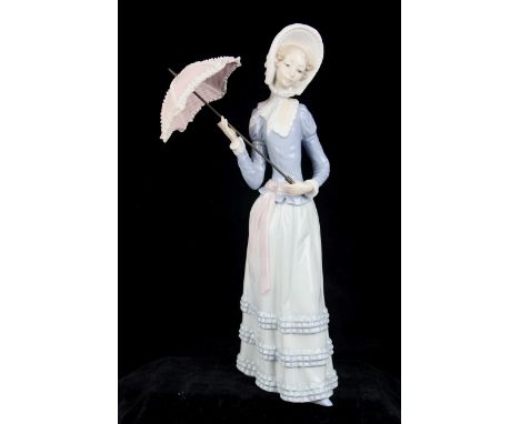 Lladro - 'Little Lady', model no.4840 by Vincente Martinez, willowy Victorian lady holding a pink crinoline parasol, in paste