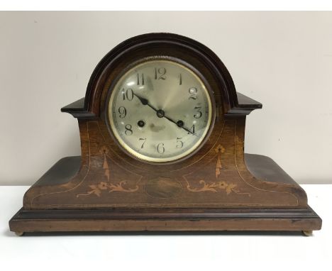 An inlaid mahogany 8 day mantel clock with silvered dial 