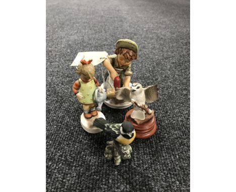 Two Goebel figures - handy man & girl, Goebel bird figure and one other 