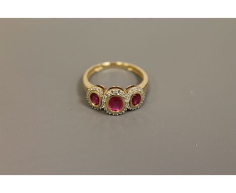 A 9ct gold ruby and diamond ring, size L/M