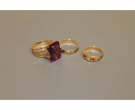 An 18ct gold ruby and diamond ring, a 9ct gold band ring and a gold ring set with a large amethyst, 11.4g gross (3)