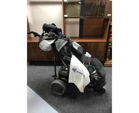 An electric Power Caddy golf cart with battery and charger, Powder Caddy golf bag containing assorted irons and drivers 