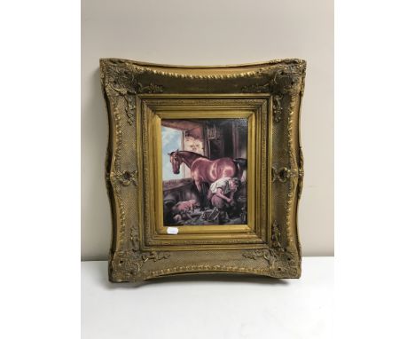 An ornate gilt framed panel depicting a farrier 