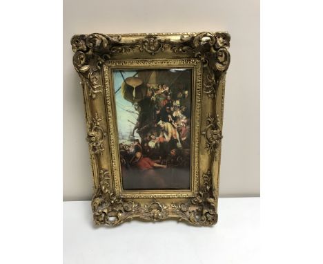 An ornate gilt framed ceramic panel depicting soldiers leaving a ship  