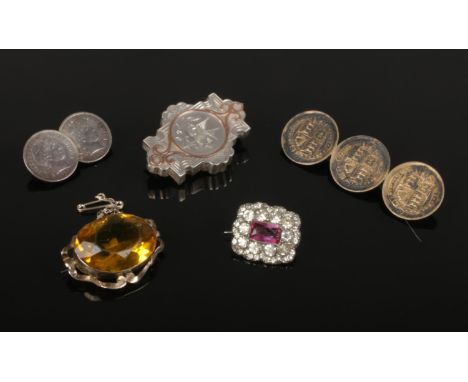 Five vintage and antique brooches including British and American coin brooches, silver Victorian brooch and coloured paste.  