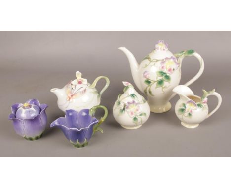 A collection of Franz porcelain, to include coffee pot with matching cream jug and sucrier, teapot etc.  Handle of purple jug