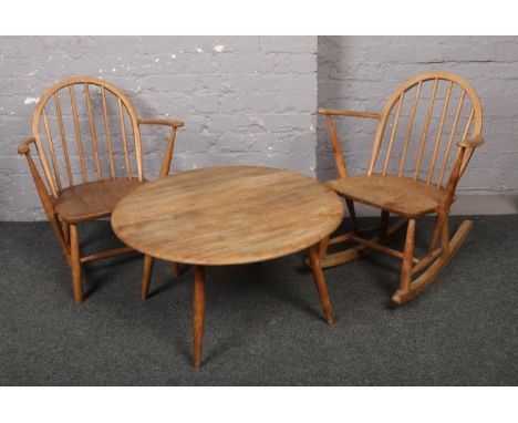 A child's vintage light elm Ercol rocking arm chair, matching arm chair, and a similar circular coffee table.  