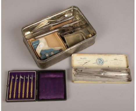 A collection of watch makers tools to include needle files etc.  