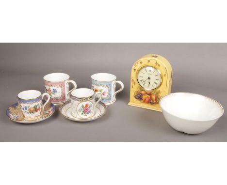 A collection of English china; Aynsley Orchard Gold mantel clock, two Spode cabinet cups and saucers Orchard and Claridge fro