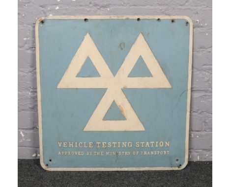 A vintage enamelled vehicle testing station sign. (64cm x 61cm).  