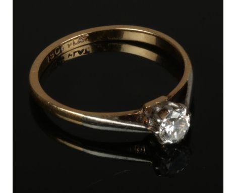 A 18ct gold and platinum diamond solitaire ring, size M, approximately 0.25ct diamond.  