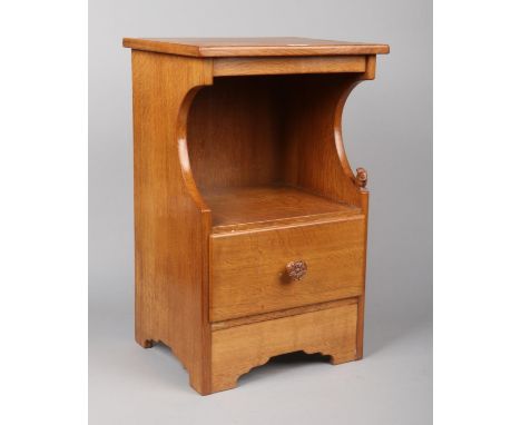 A Wilf Hutchinson Squirrel Man light oak bedside cabinet. With carved squirrel motif and Yorkshire oak handle, 69cm high. Pre