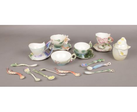 A collection of Franz porcelain, to include cups and saucers, teaspoons and a lidded pot.  Good condition. No damage.
