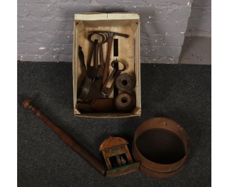 A box of mostly wooden items to include old kitchenalia, metal shears, small pick axe etc.  