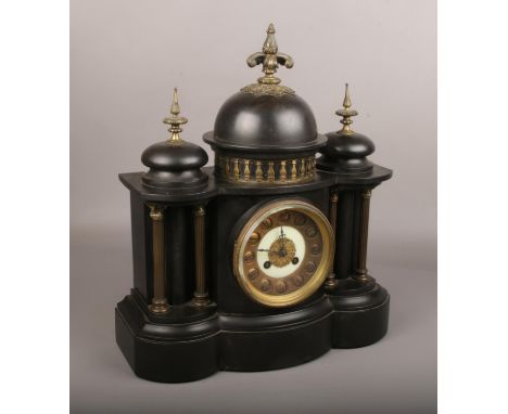 A 19th century slate mantle clock, housing a French movement, with Roman numeral markers and chiming on a coiled gong.  With 