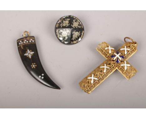 A gilt metal and enamel cross along with a pique brooch and pendant.  