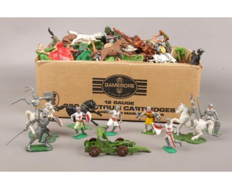 A box of vintage assorted plastic toy soldiers, horses and figures  
