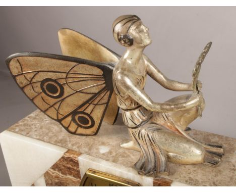 An Art Deco Marble &amp; Onyx mantel clock with mounted fairy  
