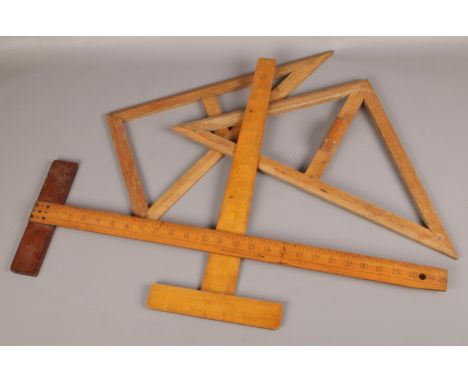 A small collection of draughstmans drawing tools including a Masson Seeley T square.  