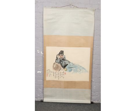 A Chinese watercolour scroll. Painted with the portrait of a resting scholar and with inscription, 170cm x 86cm.  Tear to the