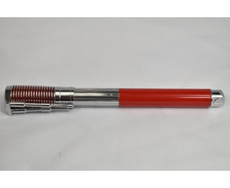 A Waterman made Harley Davidson converter fill fountain pen in red and steel, designed to look like a piston and the clip bei