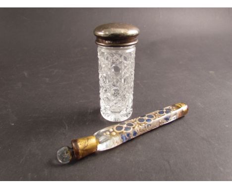 A Victorian glass scent phial with enamel decoration together with a cut glass silver topped scent bottle (2)