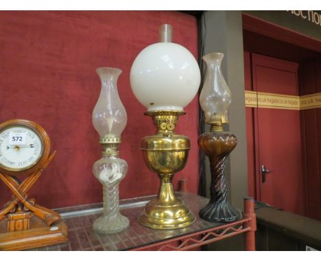A brass oil lamp with opaque shade and two twisted stem examples (3)    