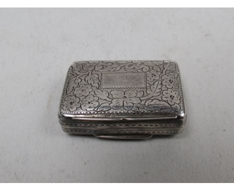 A Georgian silver vinaigrette engraved detail, engraved detail, gilt pierced grill, Birmingham, makers mark T.S, 3.5cm long