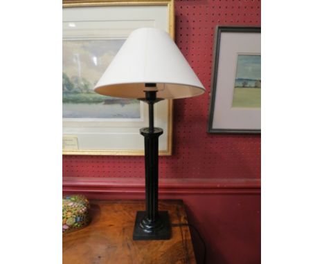 A black column form table lamp, 52cm tall 