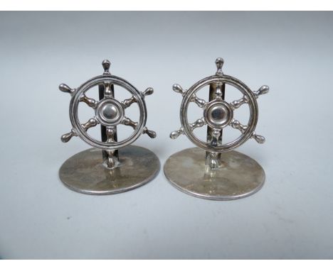 A pair of Samuel Morden & Co silver place card holders as ships wheels, Chester 1911, 73g