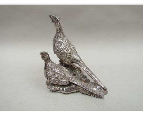 A Lawrence R Watson & Co., silver figure of two pheasants, filled, 11cm tall, Sheffield 1999
