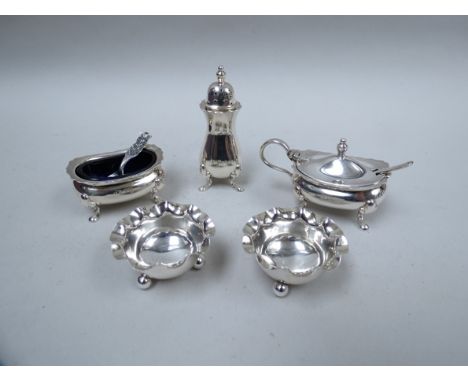 A silver three piece cruet, Birmingham 1956 and associated salts and spoons, 159g