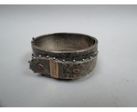 A Constantine & Floyd silver bangle of buckle form, Birmingham 1882, 39g