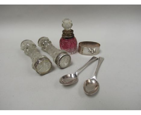 Two silver teaspoons, a silver napkin ring, cut glass scent bottle with silver collar and two cut glass knife rests (6) 