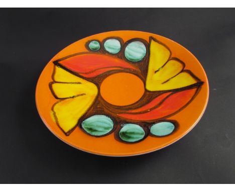 A Poole pottery plate with orange, yellow and green tones, 26cm diameter  
