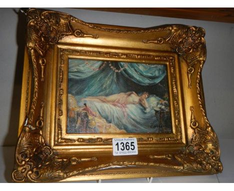 A gilt framed study of a semi nude female, 30 x 25 cm.It is an over painted print in an antique style with gilded frame.No da