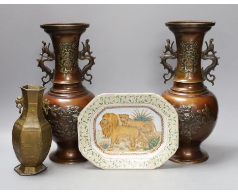 A pair of bronze Japanese vases, a Chinese pewter vase and a ‘lion’ dish 31cm