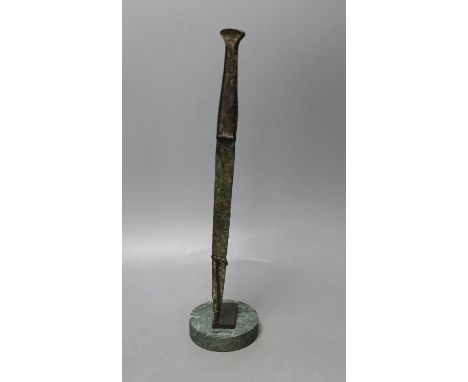 A Lurestan bronze dagger, on stand,34.5 cms high.