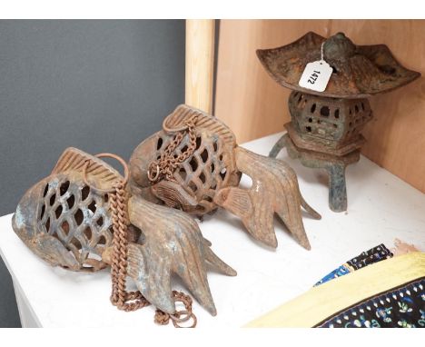 A Japanese iron lantern and two similar koi