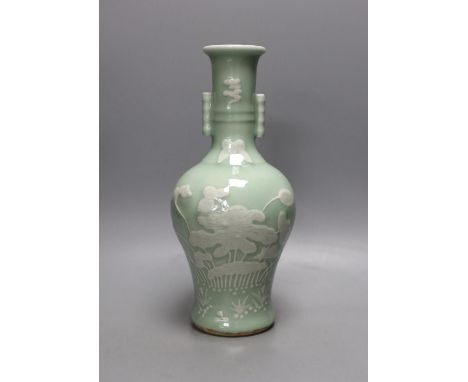A Chinese slip decorated celadon ground arrow vase 28cm