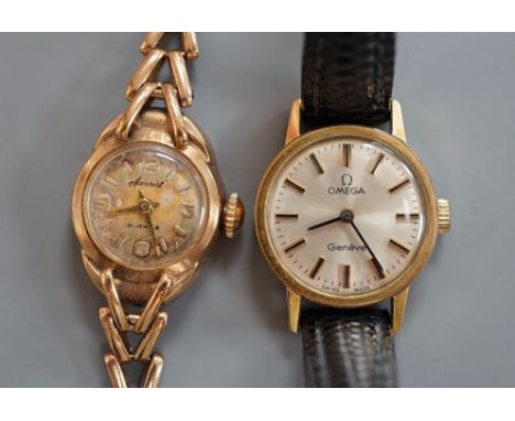 A lady's 9ct gold Accurist manual wind wrist watch, on a 9ct gold bracelet, gross weight 13 grams and a lady's steel and gold