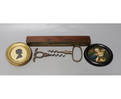 A George III framed silhouette, two corkscrews, spirit level and circular miniature painting