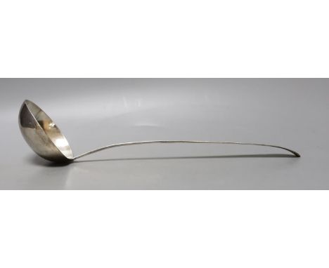 A George III Irish silver bright cut engraved soup ladle, Law &amp; Bayly, Dublin, 1794, 37cm, 191 grams.