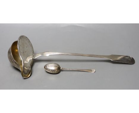 A 19th century continental white metal serving ladle, 36cm and a late Victorian silver tea infuser, gross 216 grams.